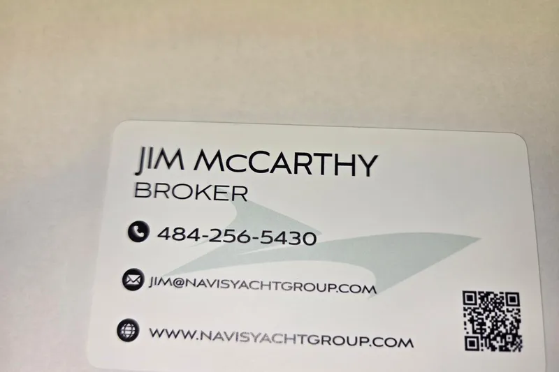 Slide: The Image of Business card for yacht broker, featuring contact details and QR code. - 59