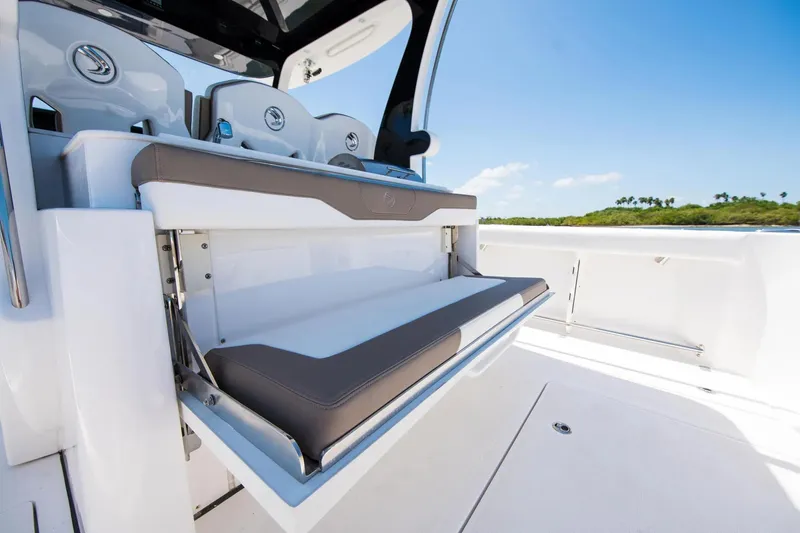 Slide: The Image of 2026 Edgewater 370CC boat interior with foldable seating and sleek design. - 10
