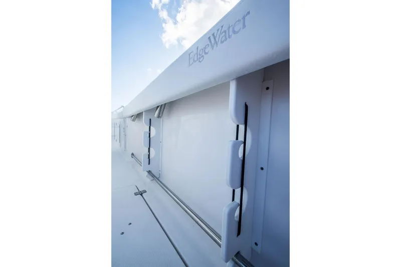Slide: The Image of Edgewater 370CC 2026 boat detail with sleek white design and modern fittings. - 12
