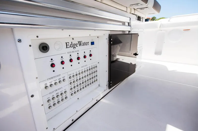 Slide: The Image of 2026 Edgewater 370CC boat electrical panel with switches and breakers. - 14