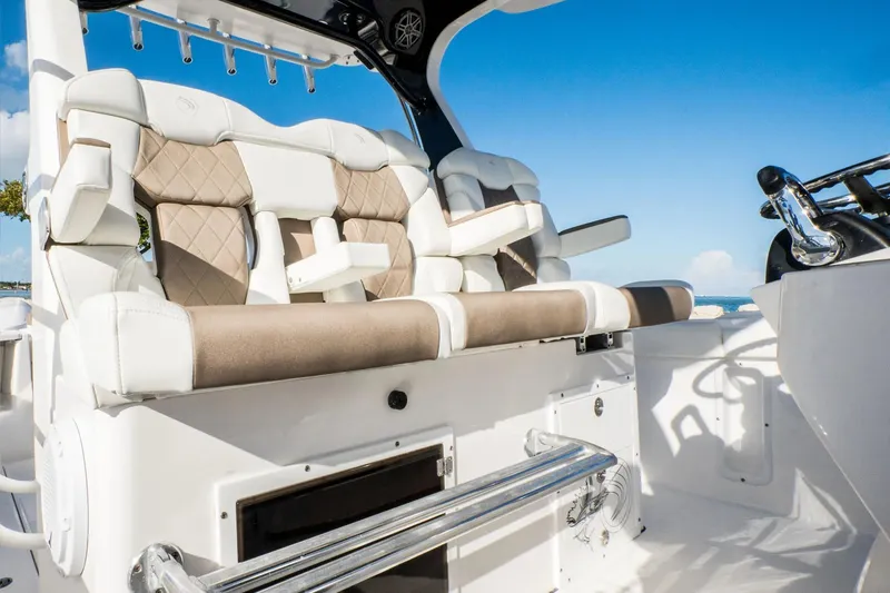 Slide: The Image of Luxury seating on 2026 Edgewater 370CC boat, featuring plush cushions and sleek design. - 15