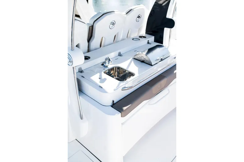 Slide: The Image of 2026 Edgewater 370CC boat interior with sink and grill station. - 16