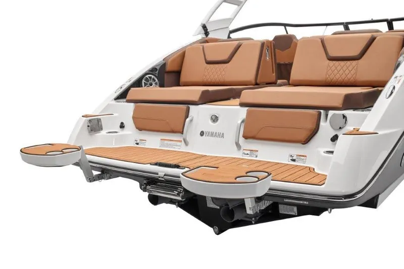 Slide: The Image of 2026 Yamaha Boats 252SD rear view with tan seating and swim platform. - 13