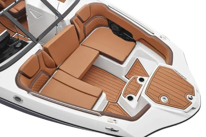 Slide: The Image of Luxurious interior of 2026 Yamaha Boats 252SD with tan seating and wood accents. - 15