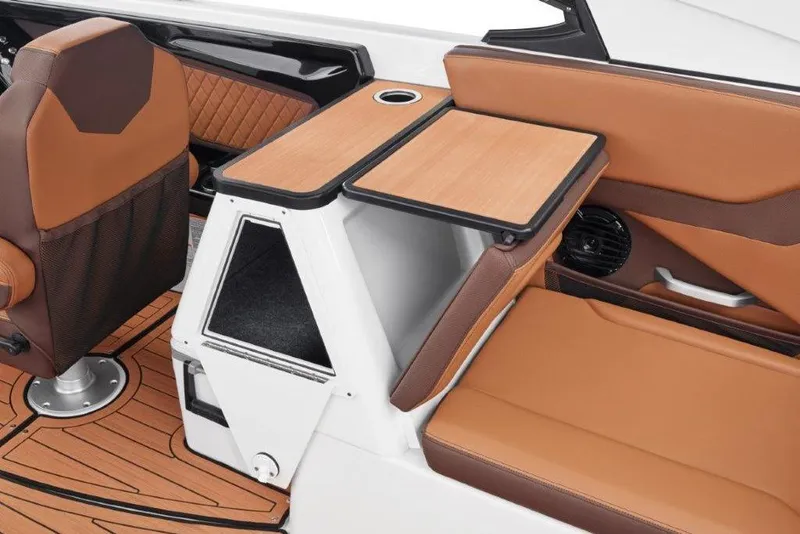 Slide: The Image of 2026 Yamaha Boats 252SD interior with brown seating and foldable table. - 18