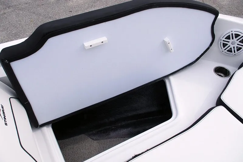 Slide: The Image of Open storage compartment on 2026 Stingray 182 SC boat, featuring sleek white interior design. - 11