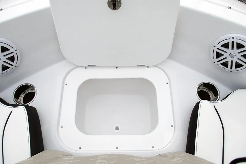 Slide: The Image of 2026 Stingray 182 SC boat interior with storage compartment and speakers. - 13