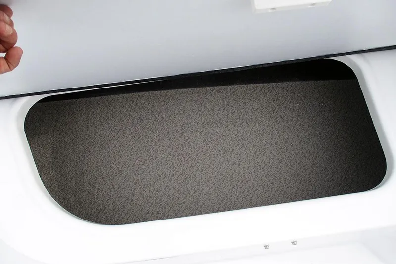 Slide: The Image of Storage compartment in 2026 Stingray 182 SC boat, featuring a textured interior surface. - 19