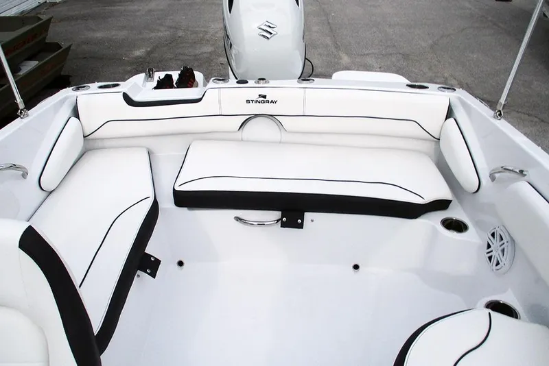 Slide: The Image of 2026 Stingray 182 SC boat interior with white seating and black trim. - 22