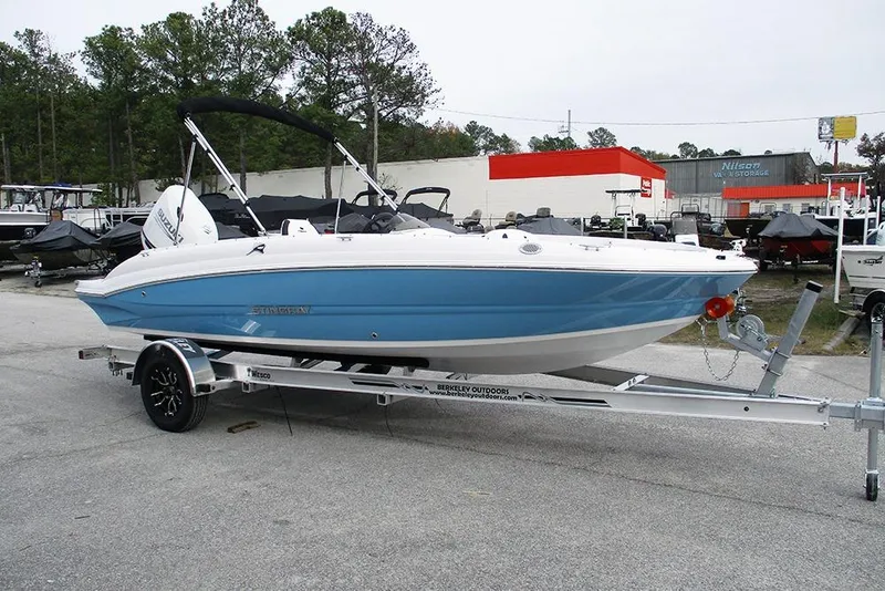 Slide: The Image of 2026 Stingray 182 SC boat on trailer in outdoor storage area. - 3