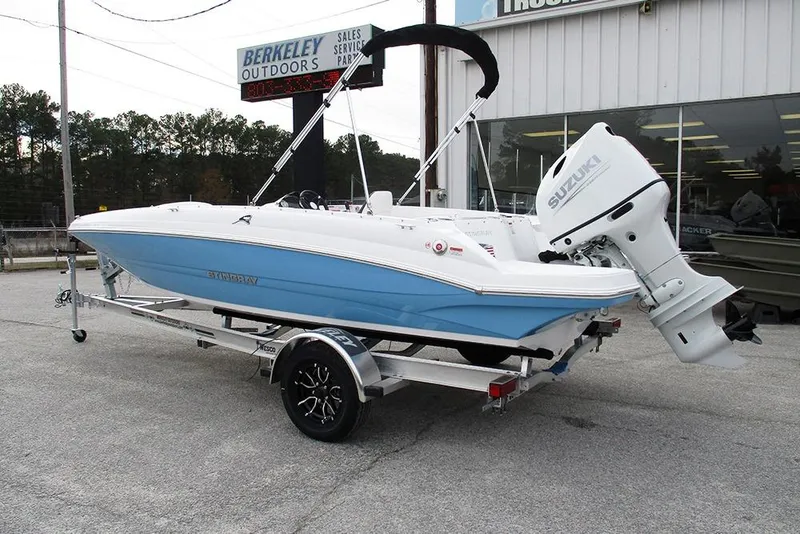 Slide: The Image of 2026 Stingray 182 SC boat with Suzuki outboard motor on trailer at dealership. - 7