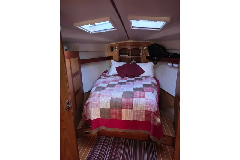 Slide: The Image of Hunter 460 sailboat from 2000 docked at marina with paddleboards. - 10