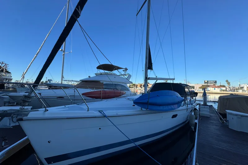 Slide: The Image of Cozy cabin interior of 2000 Hunter 460 sailboat with bed and storage. - 24