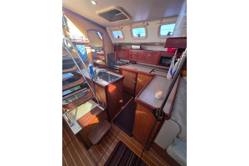 Slide: The Image of Inflatable boat docked near a bridge, featuring an American flag and rowers in the background. - 8