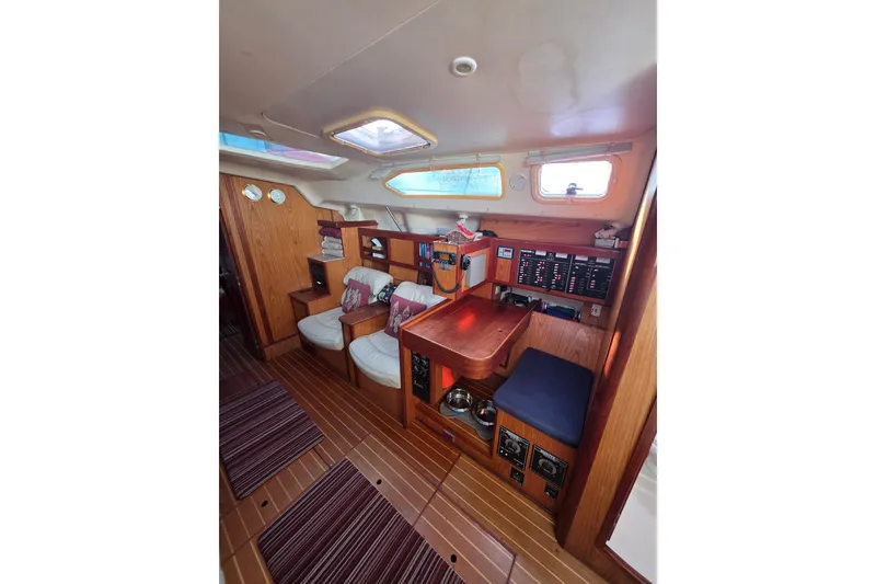 Slide: The Image of Cockpit of 2000 Hunter 460 sailboat with steering wheel and navigation instruments. - 9