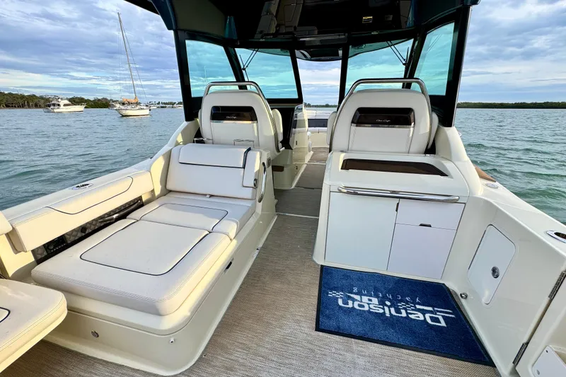 Slide: The Image of 2021 Chris-Craft Calypso 35 interior with luxurious seating and scenic water view. - 15