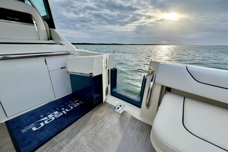 Slide: The Image of 2021 Chris-Craft Calypso 35 boat interior with ocean view at sunset. - 18