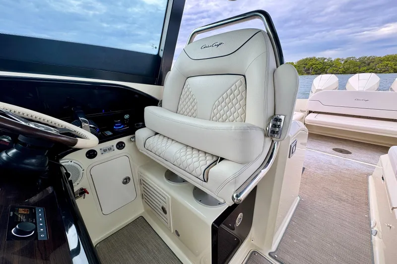 Slide: The Image of 2021 Chris-Craft Calypso 35 interior with luxurious seating and helm controls. - 24