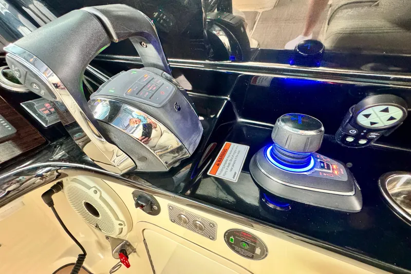 Slide: The Image of Control panel of 2021 Chris-Craft Calypso 35 boat with joystick and throttle. - 28