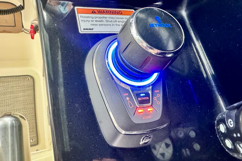 Slide: The Image of 2021 Chris-Craft Calypso 35 Skyhook control system with warning label. - 29