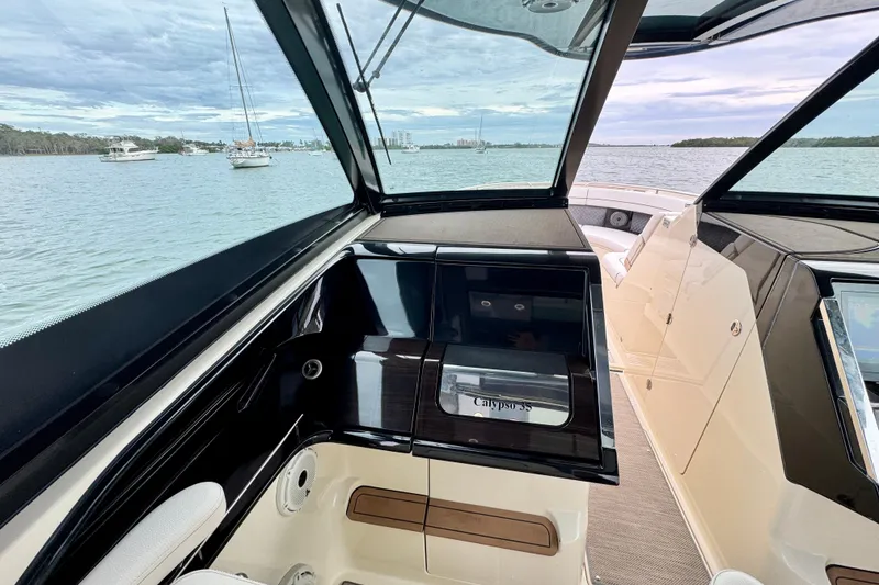 Slide: The Image of 2021 Chris-Craft Calypso 35 interior with sleek design and waterfront view. - 31