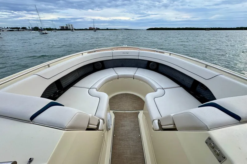 Slide: The Image of 2021 Chris-Craft Calypso 35 boat interior with luxurious seating on calm waters. - 34
