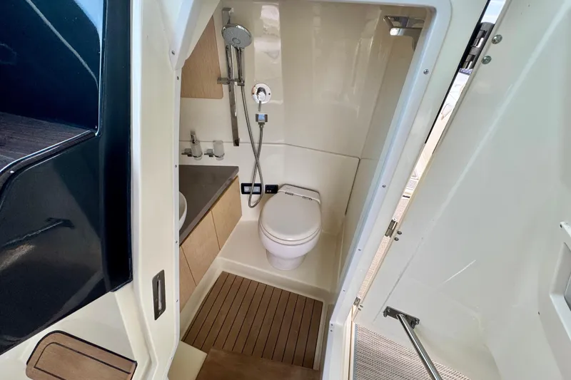 Slide: The Image of 2021 Chris-Craft Calypso 35 boat bathroom with modern fixtures and wooden flooring. - 41
