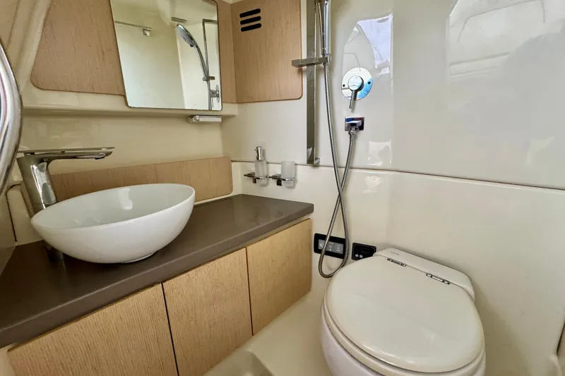Slide: The Image of 2021 Chris-Craft Calypso 35 bathroom with modern sink, toilet, and shower. - 42