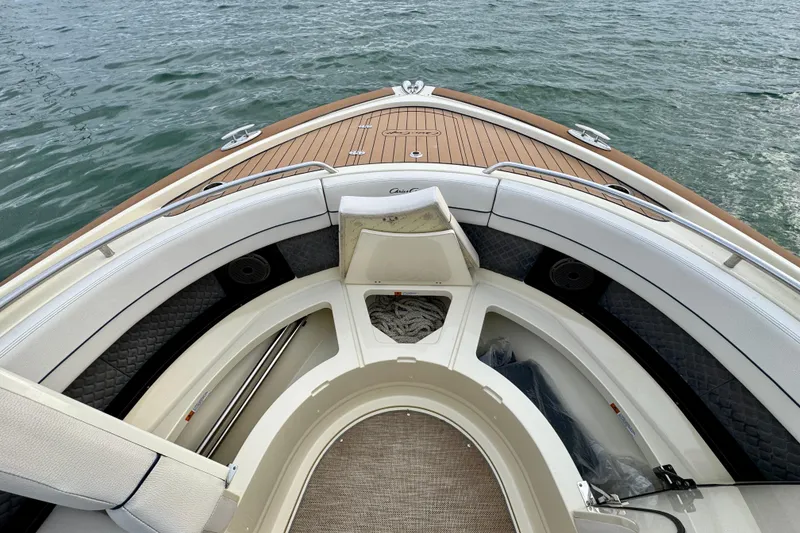 Slide: The Image of 2021 Chris-Craft Calypso 35 boat interior with elegant seating and teak deck. - 44