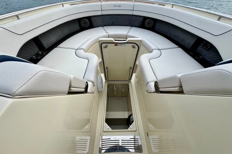 Slide: The Image of 2021 Chris-Craft Calypso 35 boat interior with luxurious seating and storage compartment. - 46