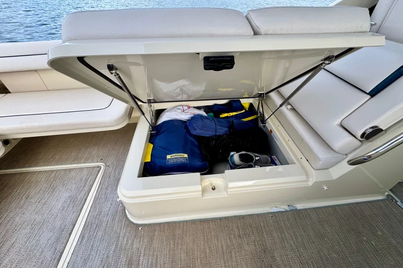 Slide: The Image of 2021 Chris-Craft Calypso 35 boat storage compartment with gear and accessories. - 47
