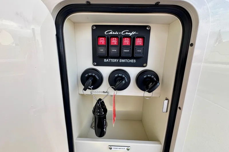 Slide: The Image of Battery switches panel on 2021 Chris-Craft Calypso 35 boat, featuring labeled controls. - 49