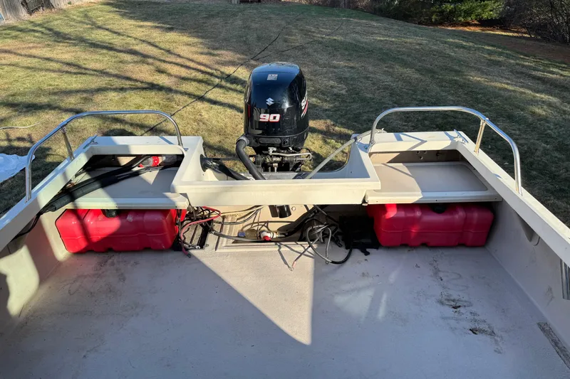 Slide: The Image of 2007 Cape Island Pilot boat with Suzuki 90 engine and red fuel tanks on grass. - 9