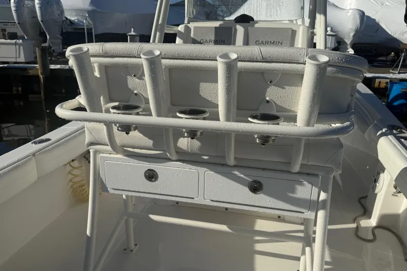 Slide: The Image of 2019 Regulator 23 boat interior with rod holders and Garmin electronics. - 26