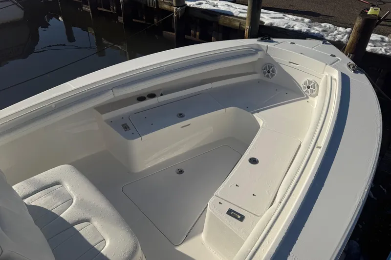 Slide: The Image of 2019 Regulator 23 boat interior with seating and storage compartments. - 28