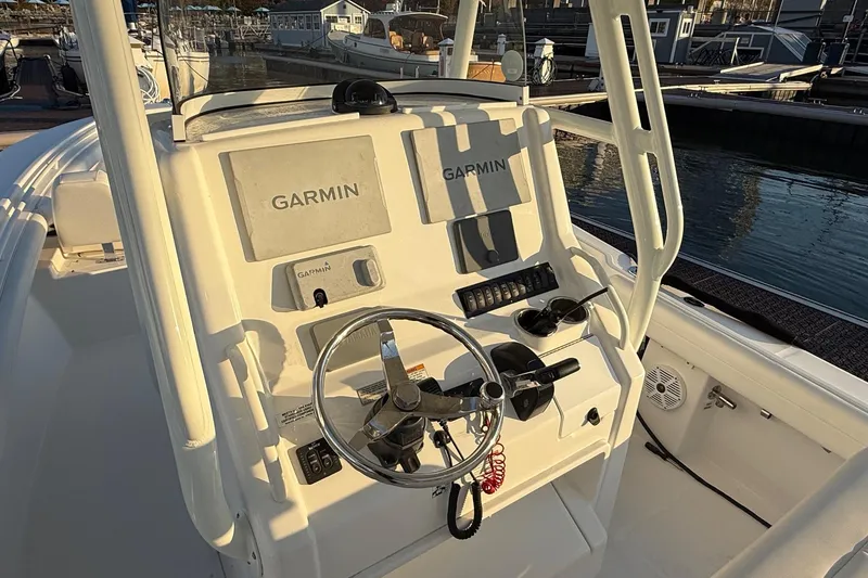 Slide: The Image of 2019 Regulator 23 boat console with Garmin navigation system at marina. - 9