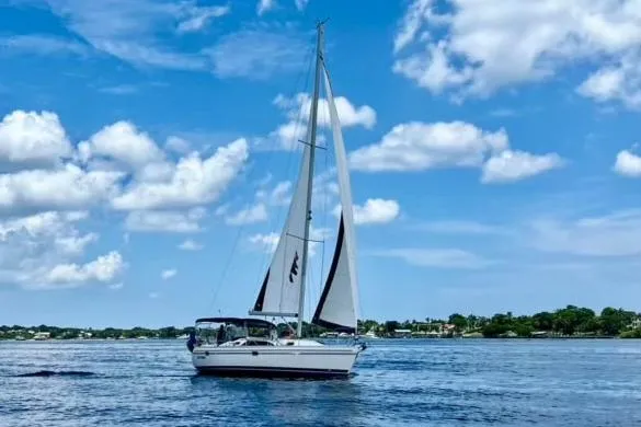 The Image of Sailboat Catalina 355 (2011) cruising on a sunny day with blue skies and clouds. - 0