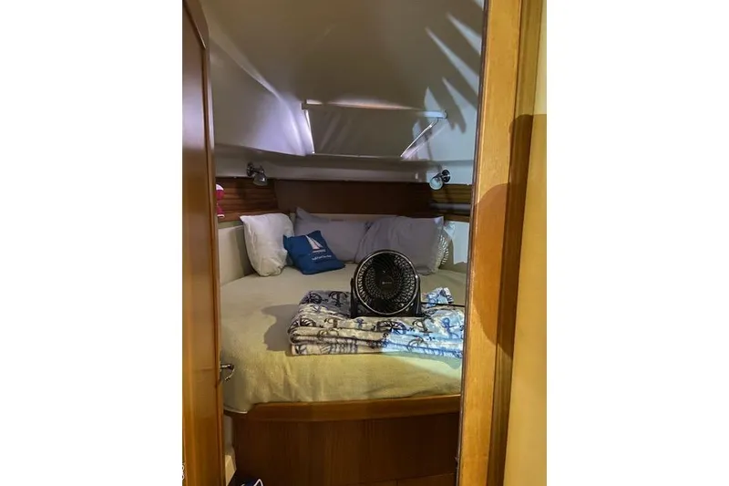 Slide: The Image of Cozy cabin interior of 2011 Catalina 355 sailboat with bed and fan. - 11