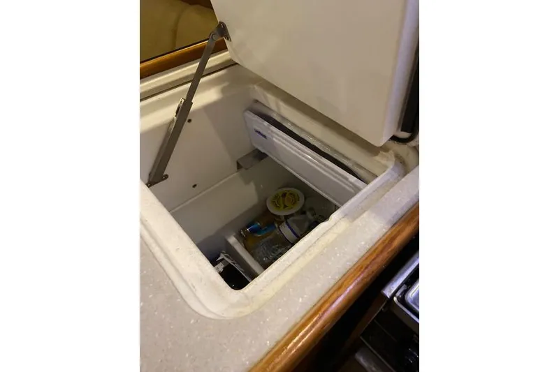 Slide: The Image of Open storage compartment in 2011 Catalina 355 yacht interior. - 13