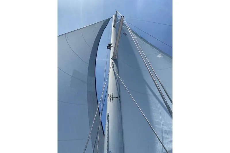 Slide: The Image of Sailboat mast and sails of a 2011 Catalina 355 under clear blue sky. - 17