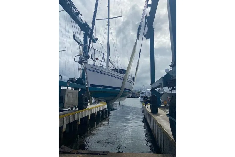 Slide: The Image of Sailboat Catalina 355 (2011) being lifted at a marina with a crane. - 28