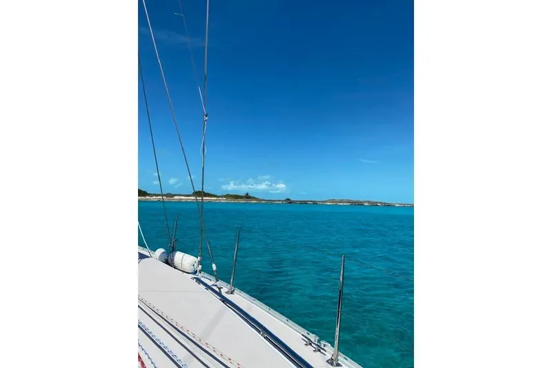 Slide: The Image of Sailboat Catalina 355 (2011) on turquoise waters under clear blue sky. - 8