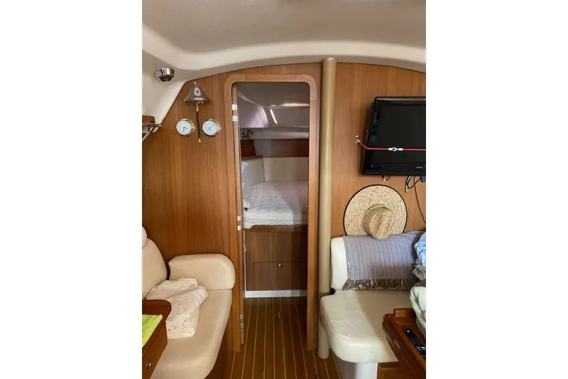 Slide: The Image of Interior of 2011 Catalina 355 sailboat with cozy cabin and wooden finish. - 9
