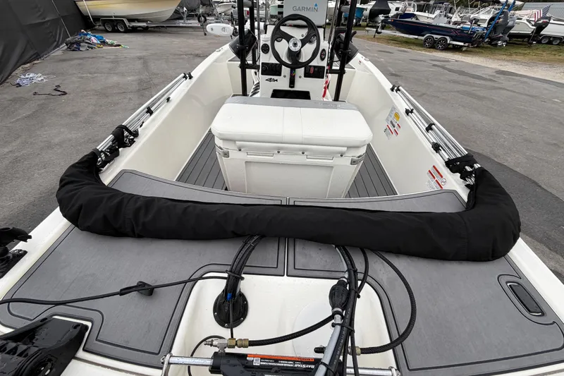Slide: The Image of 2024 Mako Pro Skiff 15 CC interior with steering console and seating. - 11