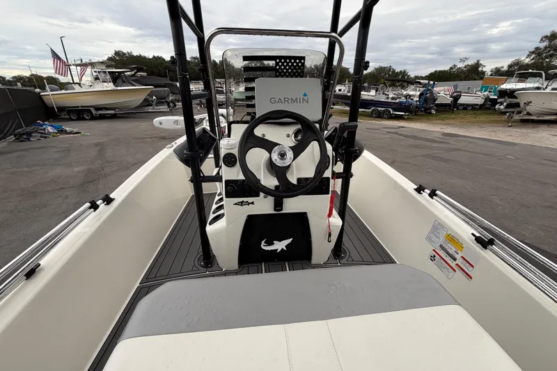 Slide: The Image of 2024 Mako Pro Skiff 15 CC boat interior with Garmin navigation system. - 12