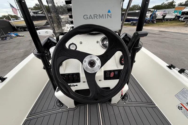 Slide: The Image of 2024 Mako Pro Skiff 15 CC boat console with Garmin navigation system. - 14