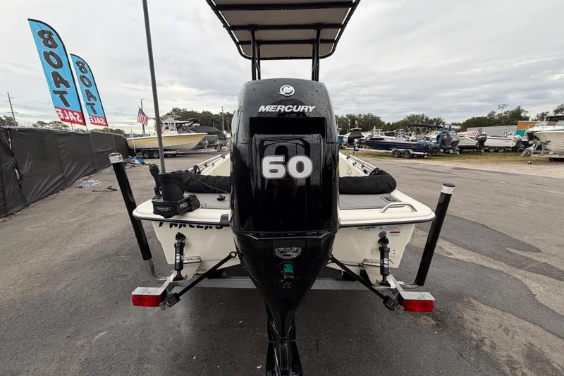 Slide: The Image of 2024 Mako Pro Skiff 15 CC with Mercury 60 engine at boat sale event. - 3
