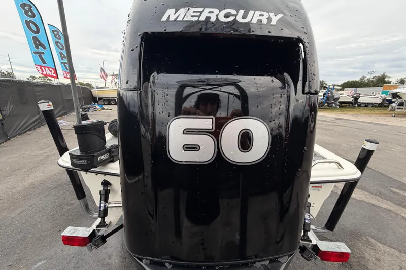 Slide: The Image of 2024 Mako Pro Skiff 15 CC with Mercury 60 outboard engine at boat sale. - 4