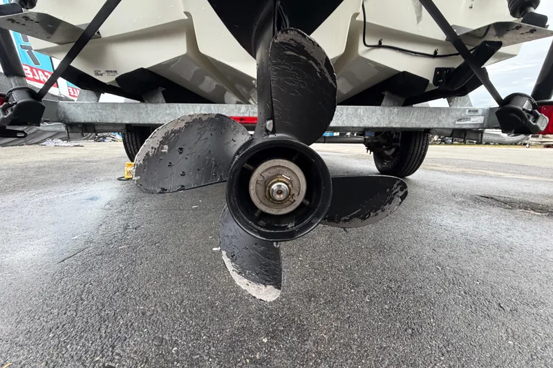 Slide: The Image of 2024 Mako Pro Skiff 15 CC boat propeller on trailer, close-up view. - 5