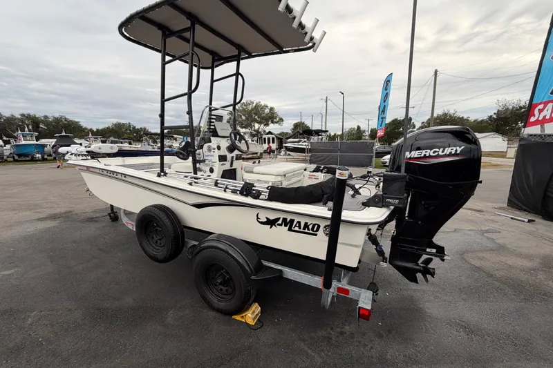 Slide: The Image of 2024 Mako Pro Skiff 15 CC boat with Mercury engine on trailer. - 6